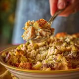 A person is serving a casserole with a spoon.