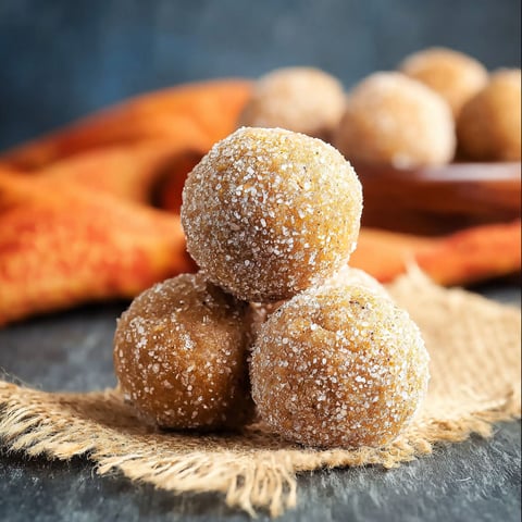 Three balls of pumpkin protein on a table.