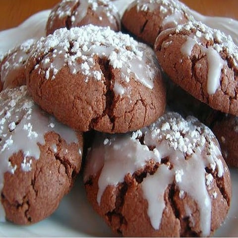 A plate of cookies with white icing.