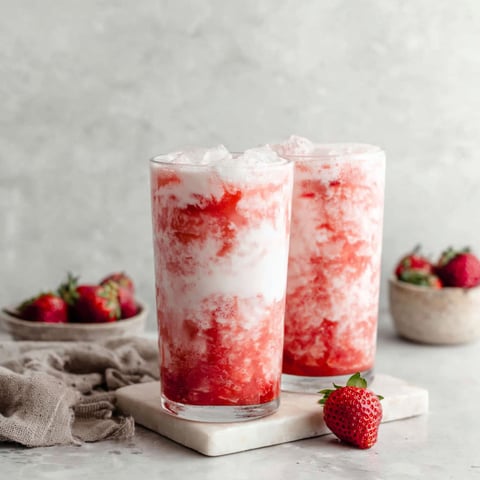 Two glasses of Korean Strawberry Milk.