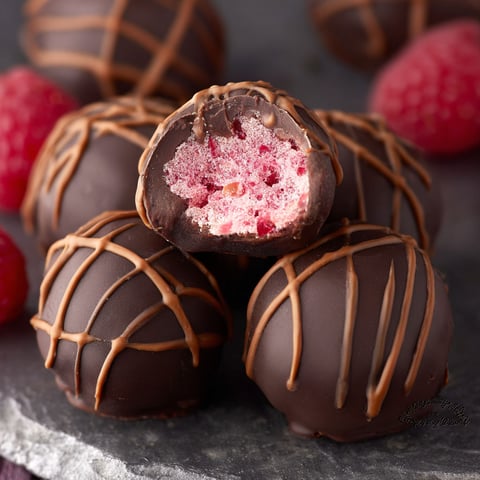 Chocolate truffles with raspberry filling.
