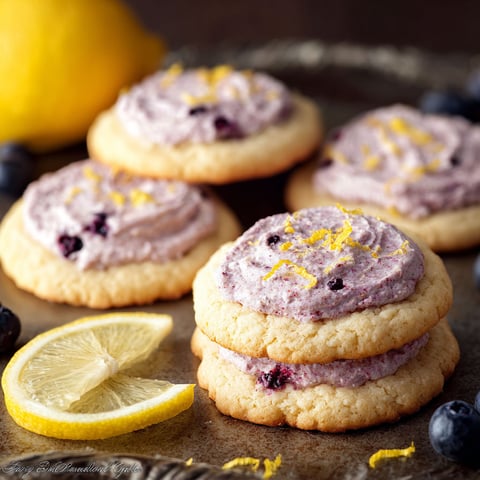 A plate of cookies with lemon and blueberry flavors.